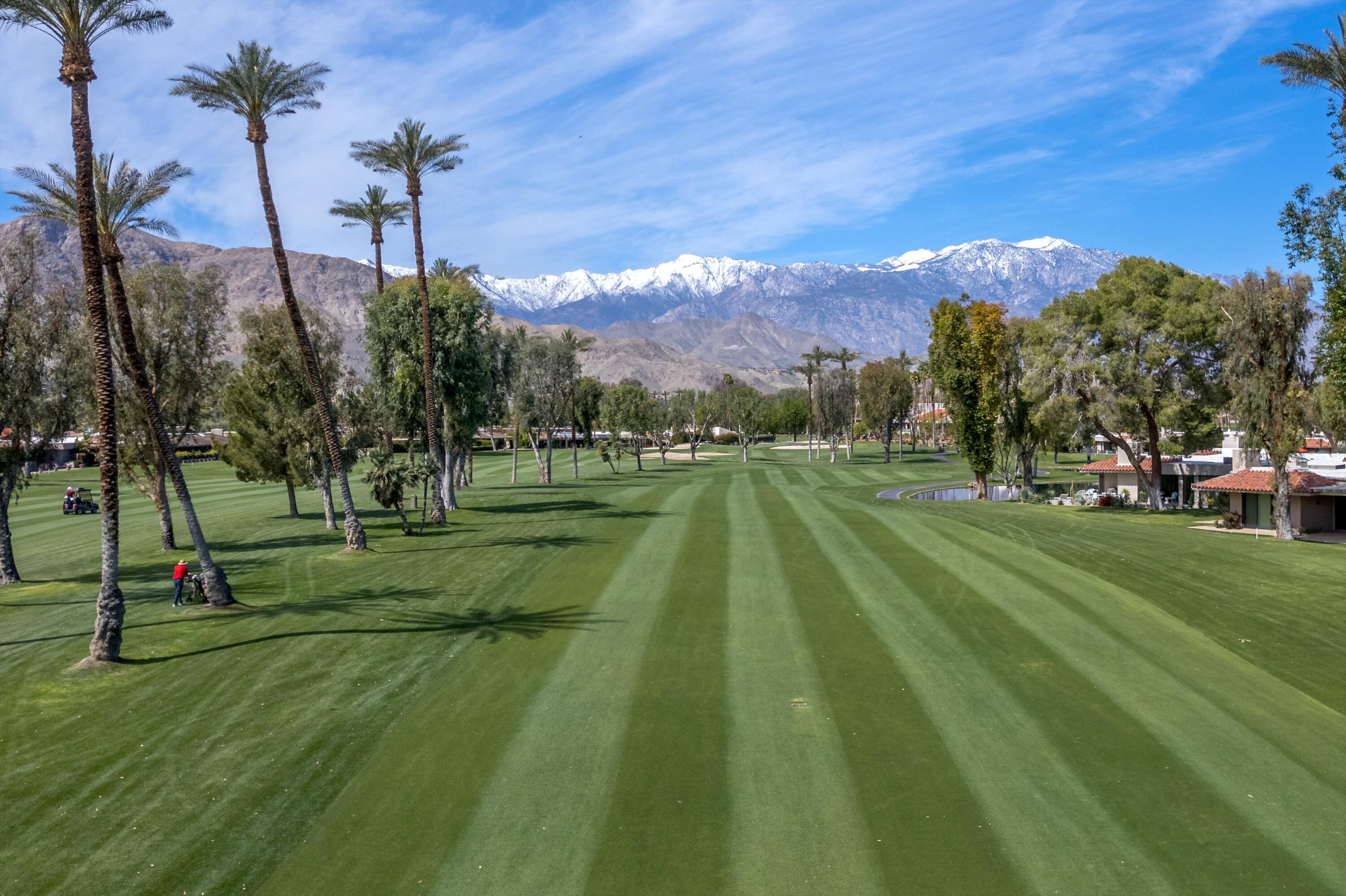 7 Wake Forest Court Rancho Mirage, CA 92270 - Photo 46 of 60 a view of a playground with a lake view