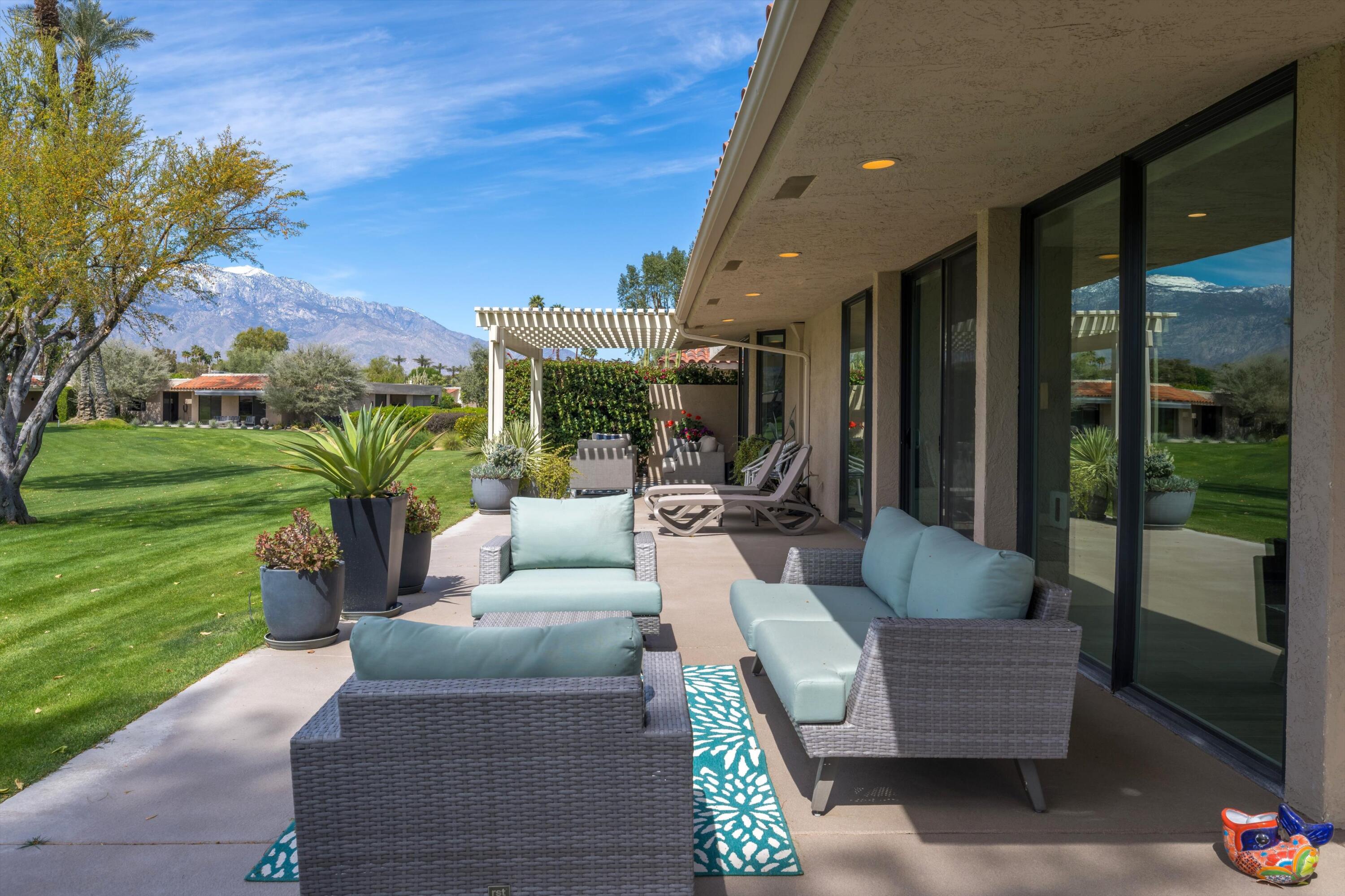 7 Wake Forest Court Rancho Mirage, CA 92270 - Photo 47 of 60 a outdoor living space with furniture potted plant and a garden