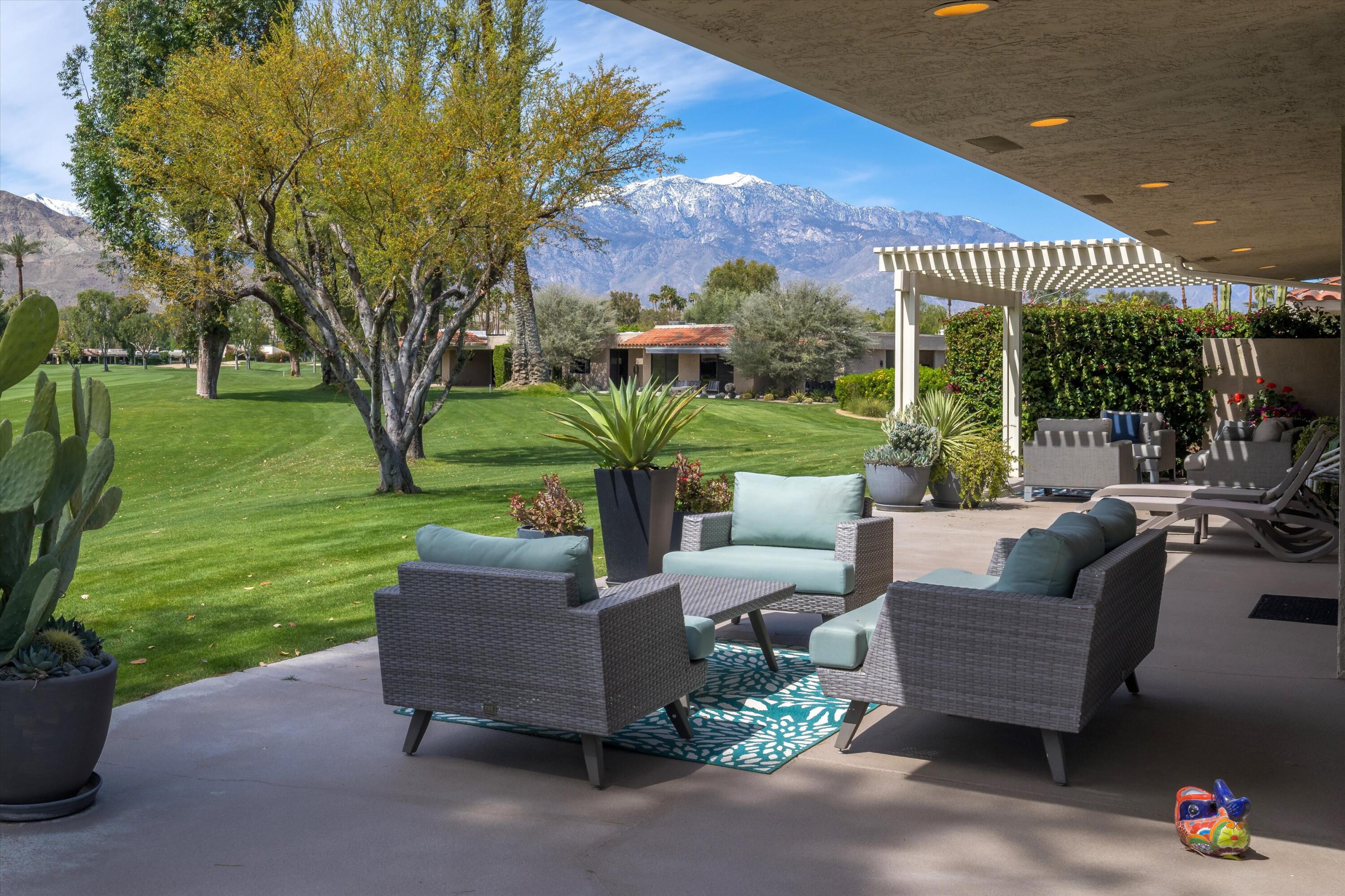 7 Wake Forest Court Rancho Mirage, CA 92270 - Photo 48 of 60 a view of a patio with couches table and chairs and potted plants