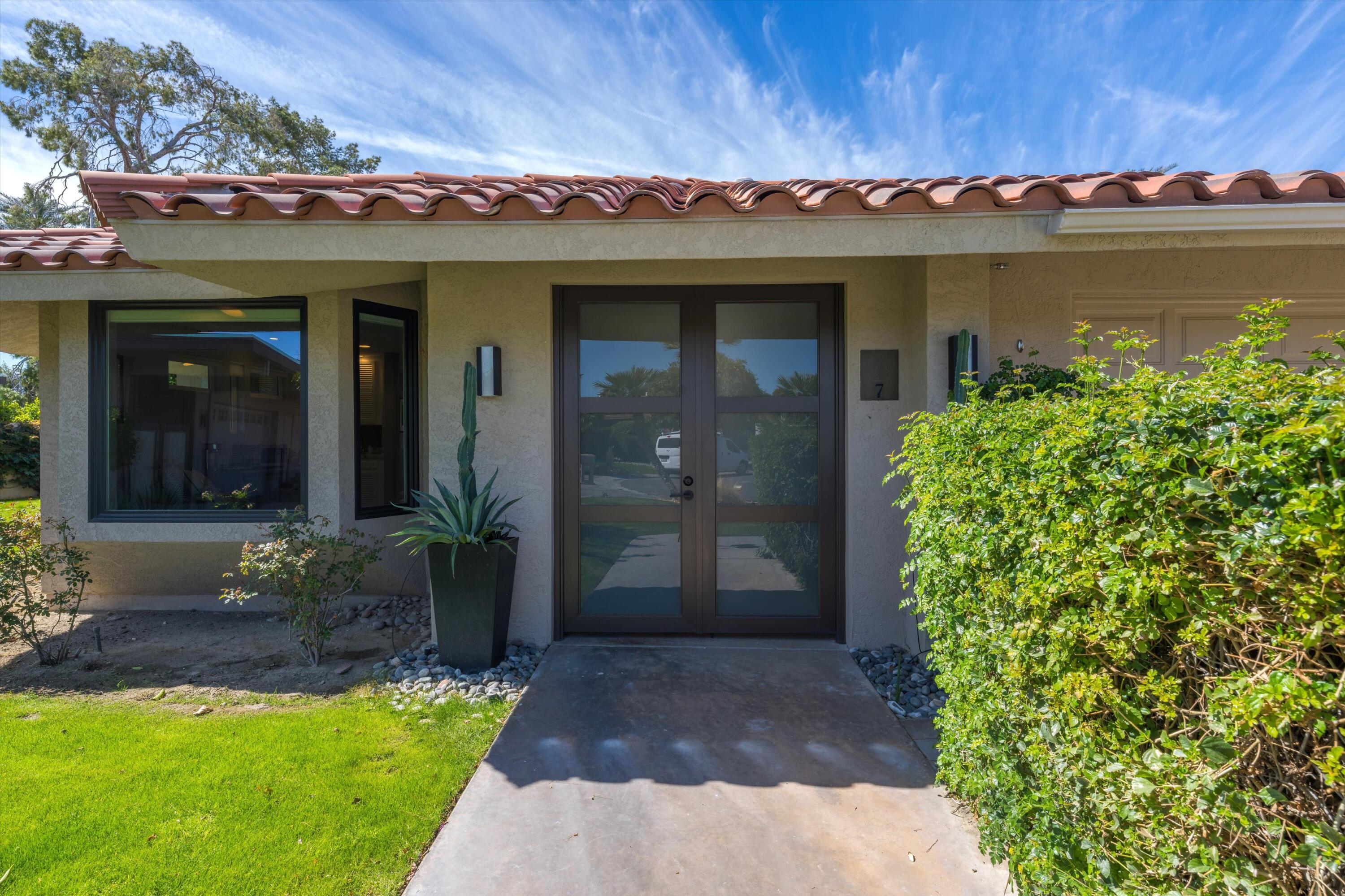 7 Wake Forest Court Rancho Mirage, CA 92270 - Photo 49 of 60 a view of a house with a yard and a fountain