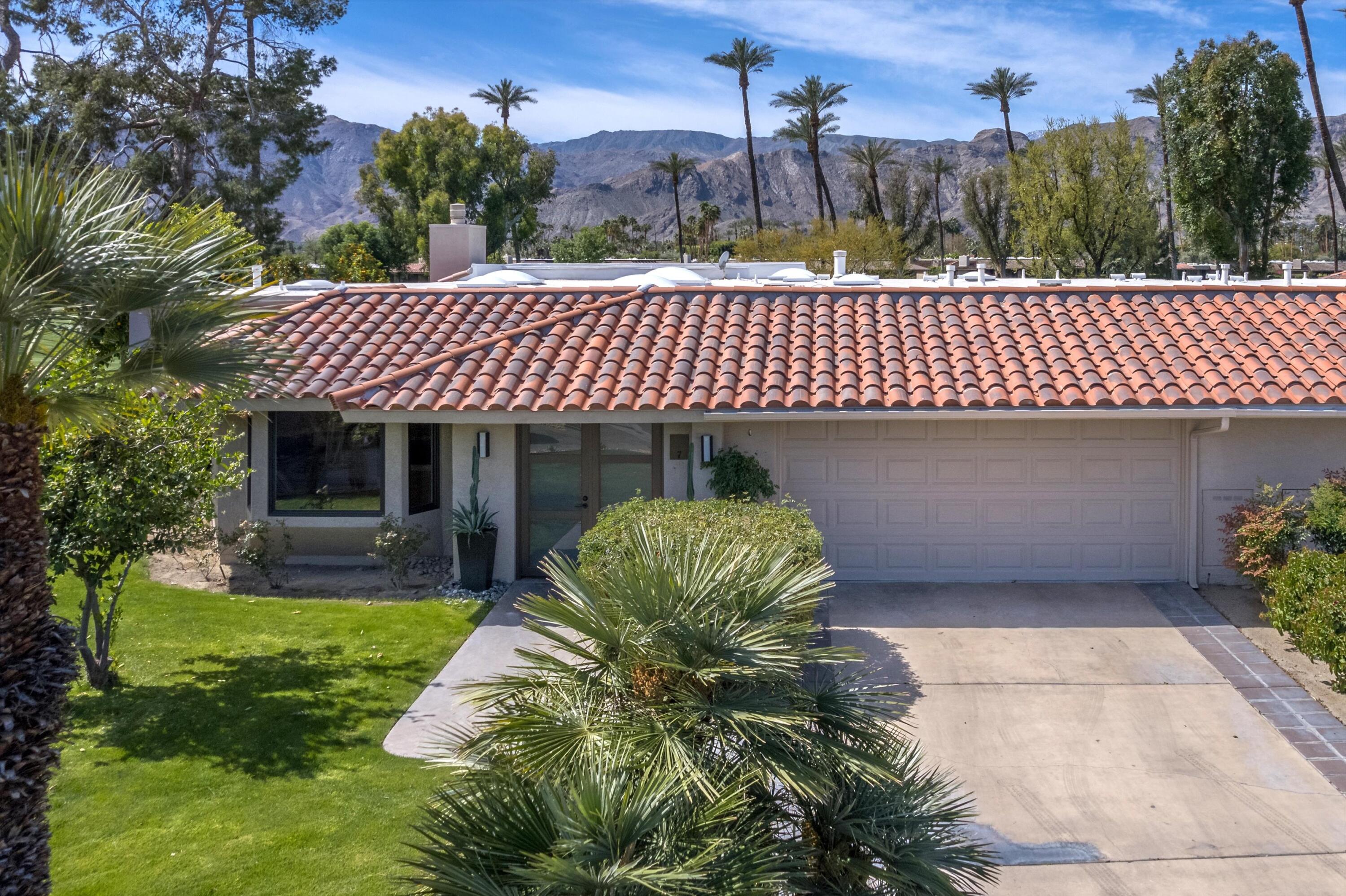 7 Wake Forest Court Rancho Mirage, CA 92270 - Photo 50 of 60 a front view of a house with garden