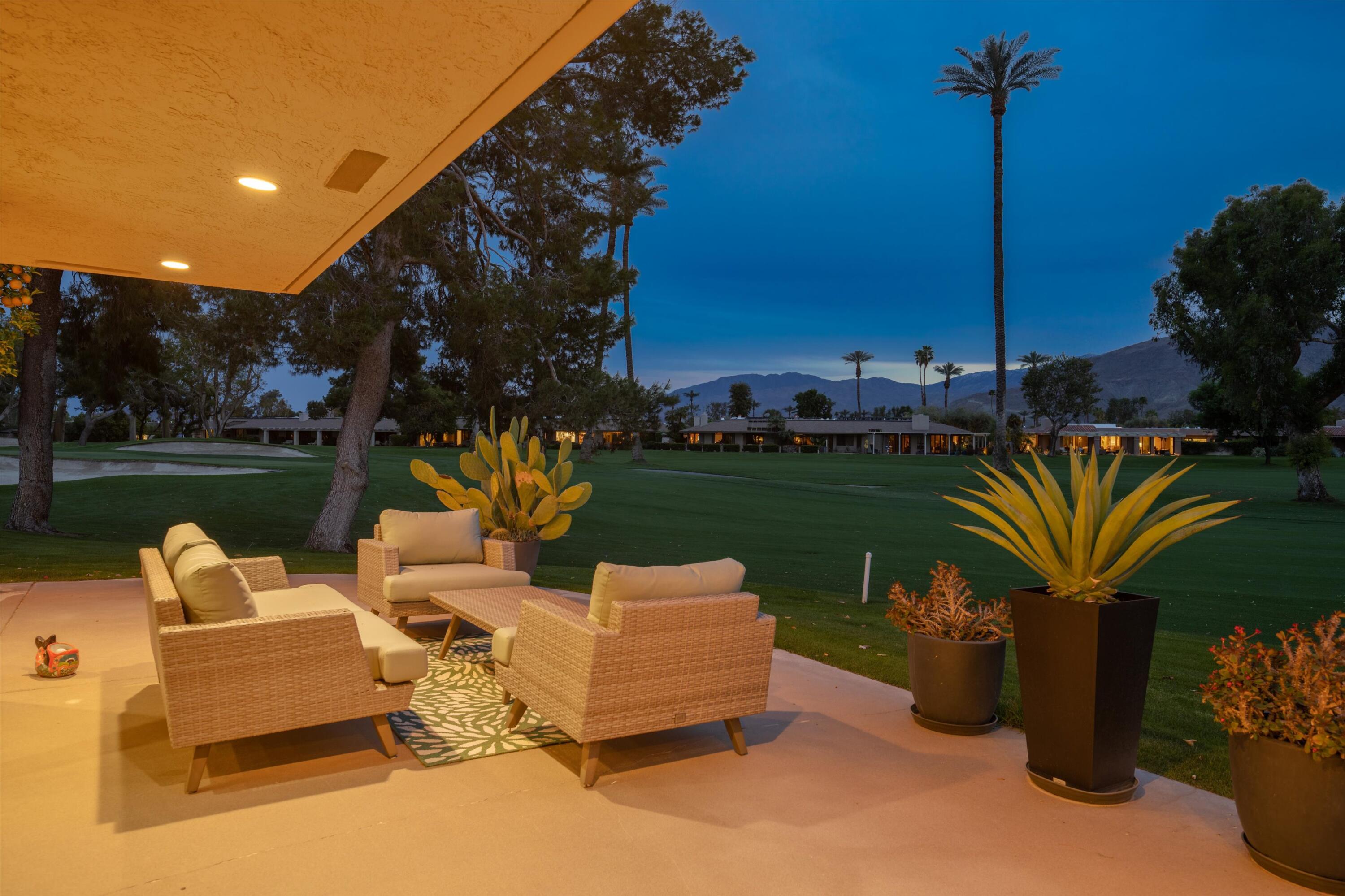 7 Wake Forest Court Rancho Mirage, CA 92270 - Photo 55 of 60 a wooden bench sitting in backside of a house with swimming pool and outdoor space