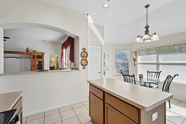 a view of a dining room with furniture and window