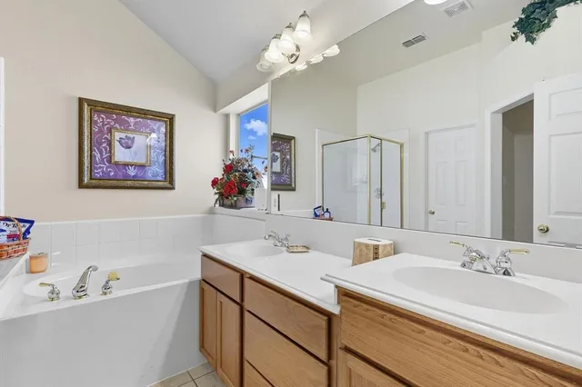 a bathroom with a sink vanity and mirror