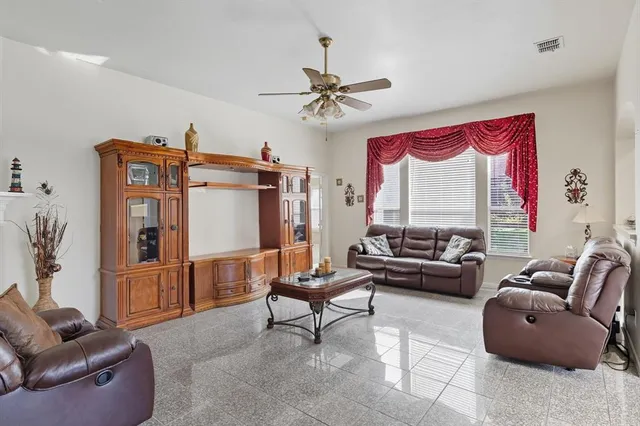 a living room with furniture and a window