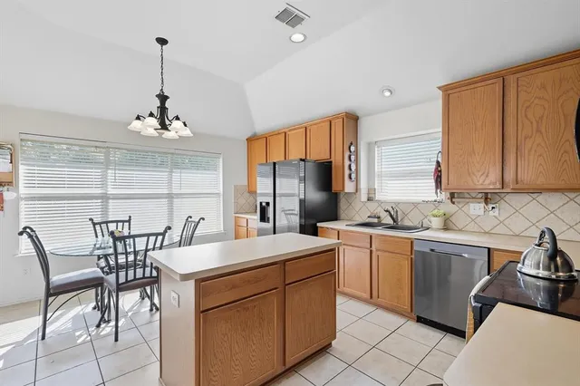 a kitchen that has a cabinets counter space and appliances