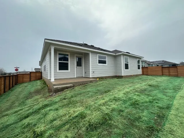 a backyard of a house with lots of green space