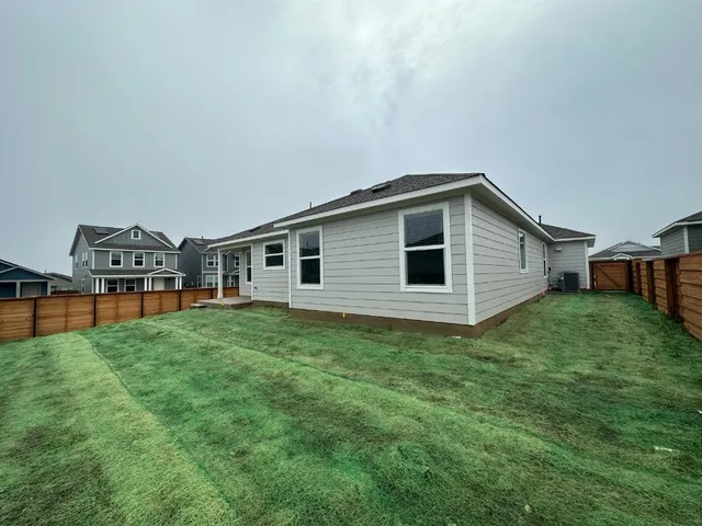 a view of a backyard of the house