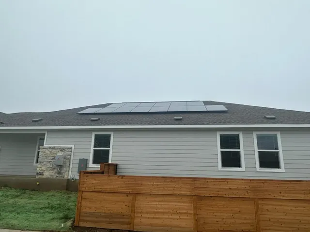 a view of house with backyard