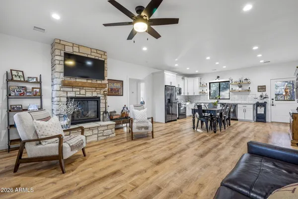 a living room with furniture and a fireplace