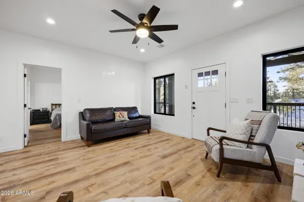a bedroom with a bed and a couch