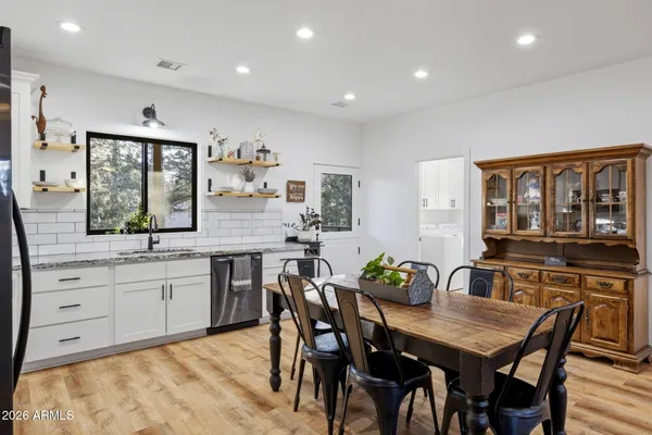 a view of a dining room with furniture window and outside view