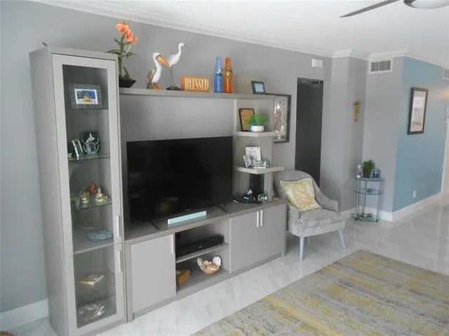 a living room with furniture a rug and a fireplace