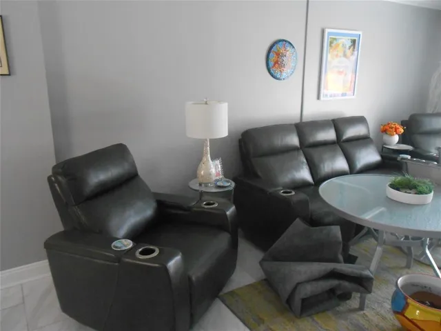 a work room with furniture and a wooden floor