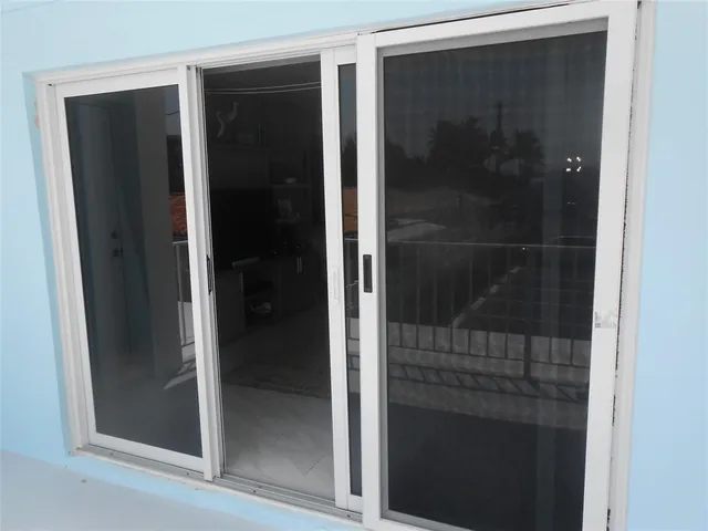 a bathroom with a glass shower door
