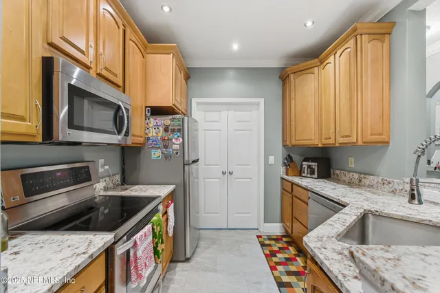 a kitchen with a stove and a microwave
