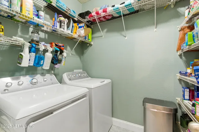 a view of a room with furniture and wooden floor