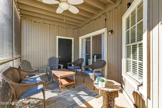 a view of a porch with a furniture