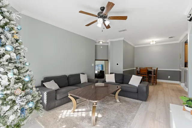 a kitchen with sink refrigerator and microwave