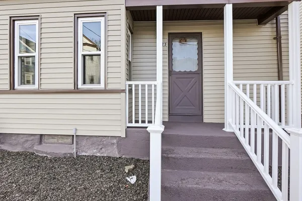 a view of a house with wooden fence