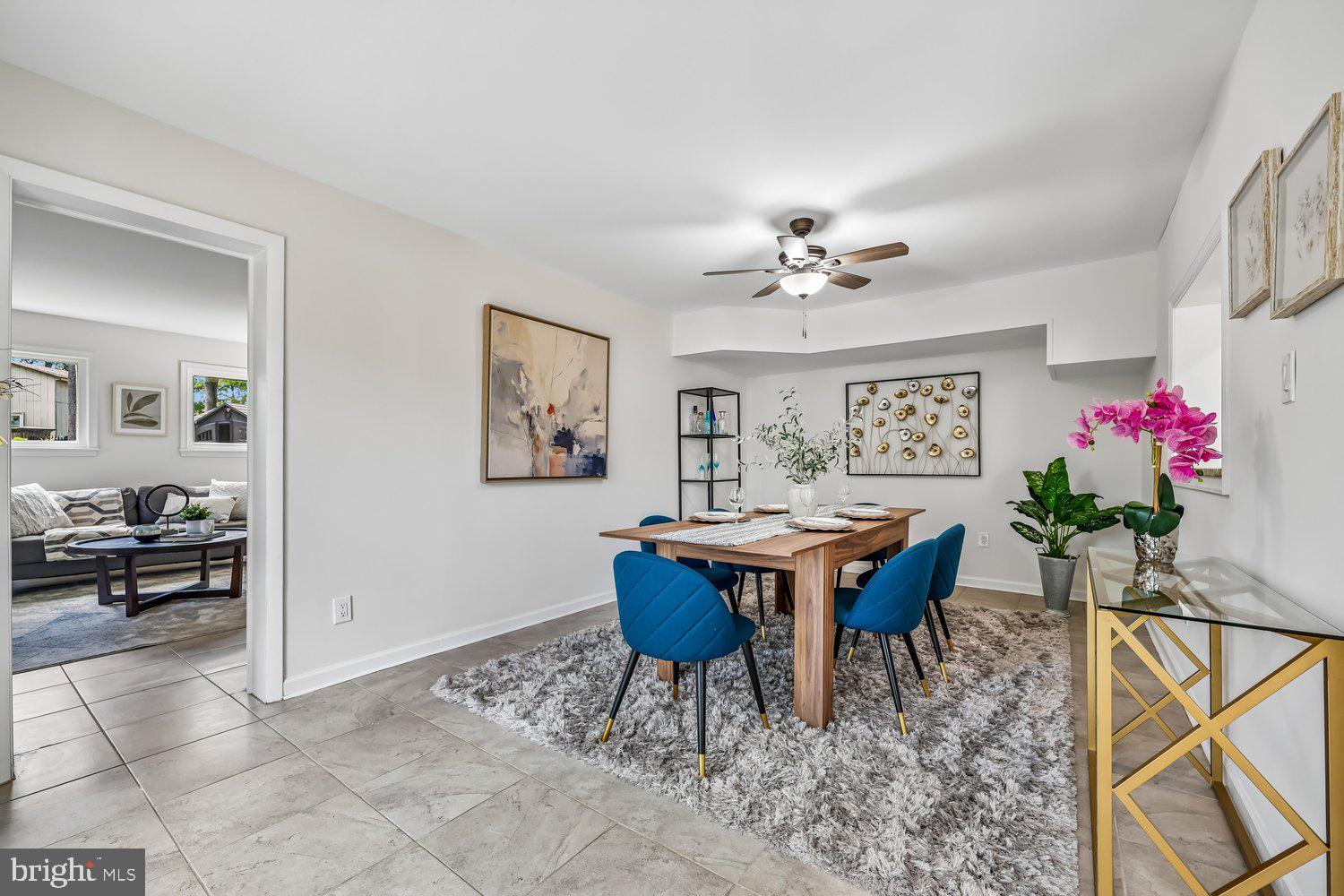 300 Gilsan Court Silver Spring, MD 20902 - Photo 49 of 117 a view of a dining room with furniture and a chandelier fan