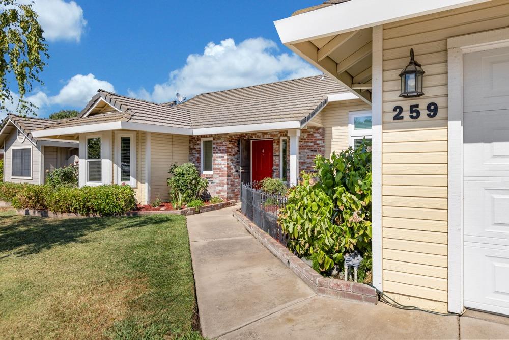 259 Emerald Oak Drive Galt, CA 95632 - Photo 1 of 1 a view of a white house next to a yard