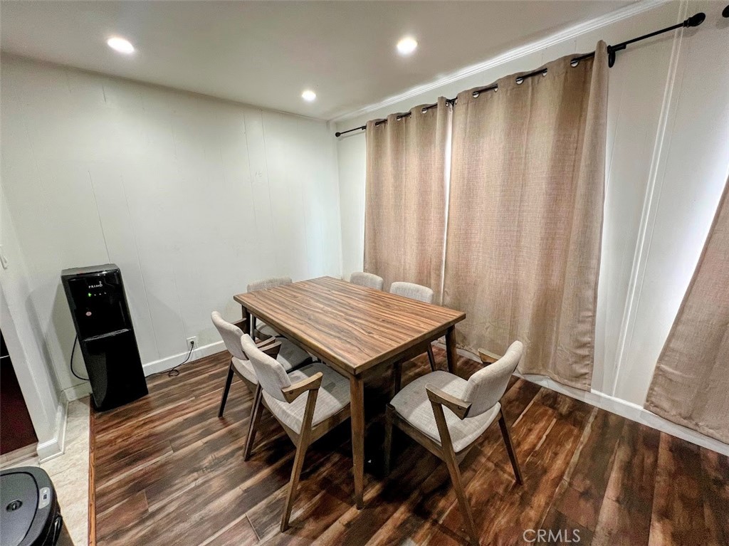 16600 Orange Avenue, Unit 124 Paramount, CA 90723 - Photo 4 of 16 a view of a dining room with furniture and wooden floor