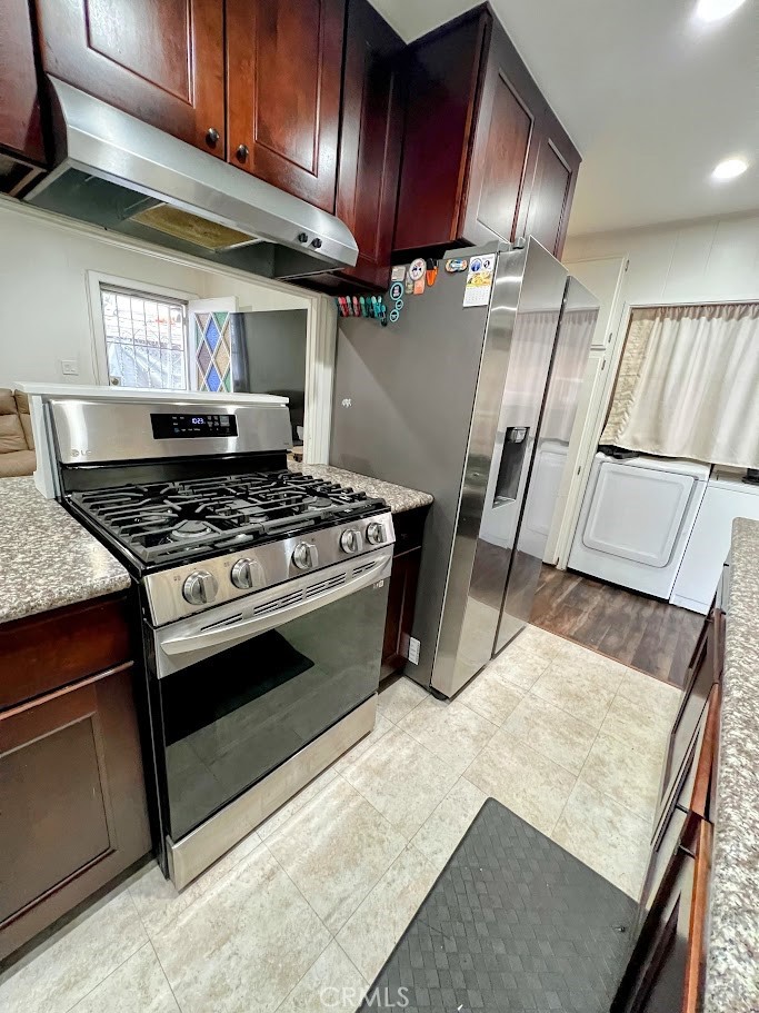 16600 Orange Avenue, Unit 124 Paramount, CA 90723 - Photo 7 of 16 a stove top oven sitting inside of a kitchen