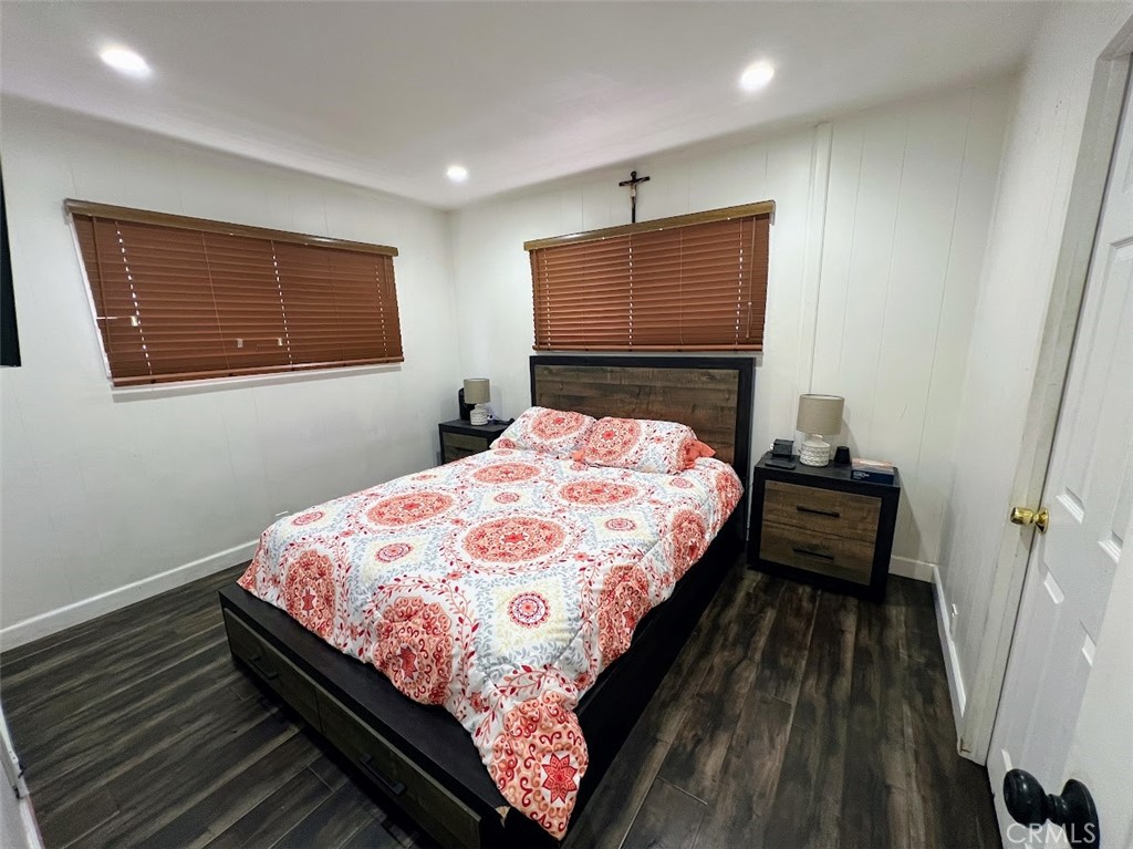 16600 Orange Avenue, Unit 124 Paramount, CA 90723 - Photo 8 of 16 a bed sitting in a bedroom next to a window