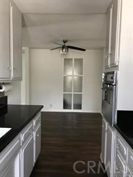 4255 West 5th Street, Unit 203 Los Angeles, CA 90020 - Photo 12 of 25 a kitchen with a refrigerator and a sink