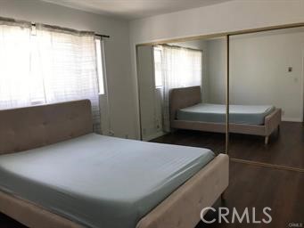 4255 West 5th Street, Unit 203 Los Angeles, CA 90020 - Photo 13 of 25 a bedroom with a bed and a window