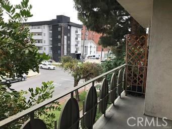 4255 West 5th Street, Unit 203 Los Angeles, CA 90020 - Photo 18 of 25 a view of a house with a street from a balcony
