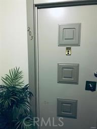 4255 West 5th Street, Unit 203 Los Angeles, CA 90020 - Photo 2 of 25 a view of a hallway with some plants