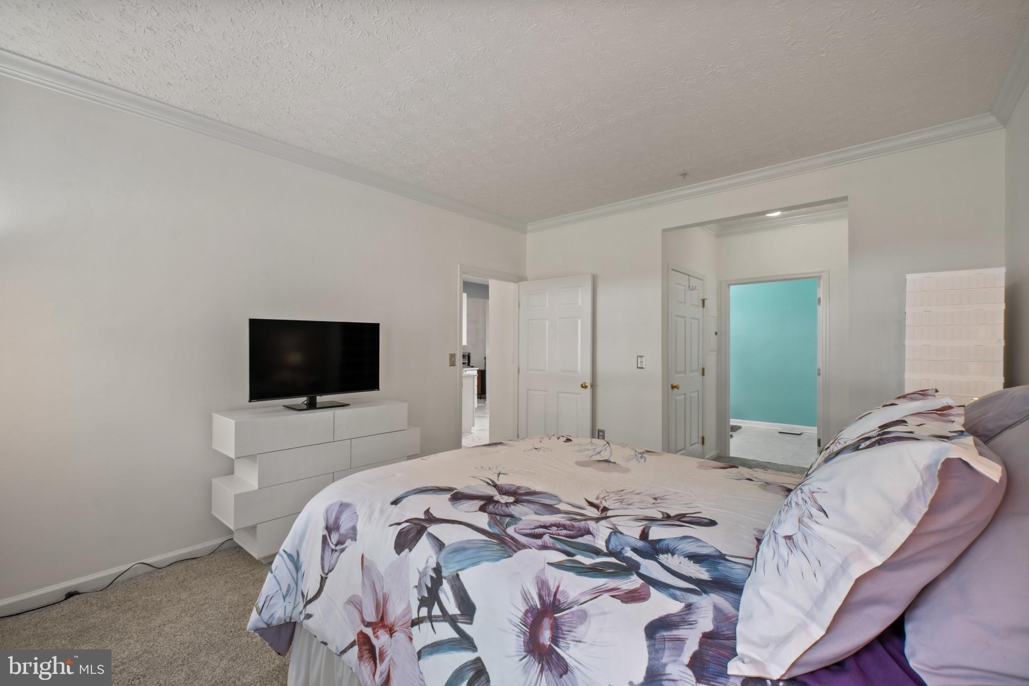 5144 Brightleaf Court, Unit 5144 Rosedale, MD 21237 - Photo 24 of 35 Serene bedroom with modern touches.