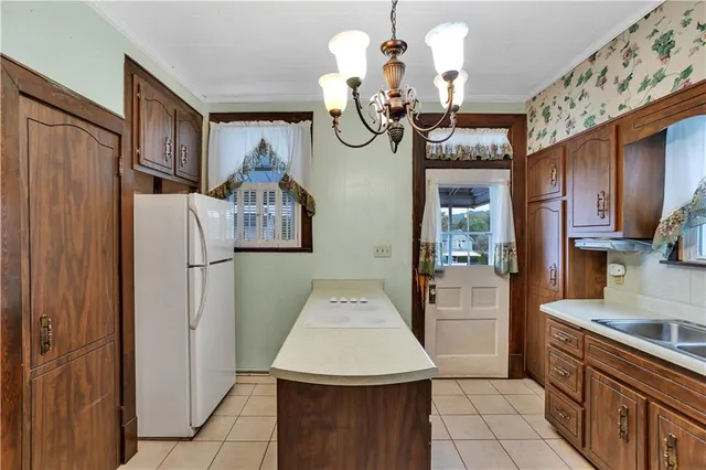 a very nice looking kitchen with a large window