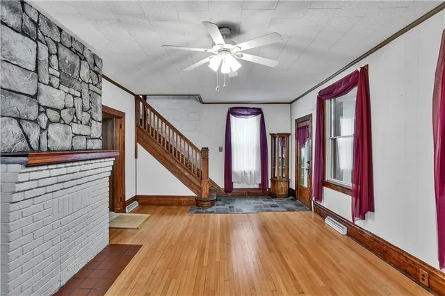 a view of entryway with stairs and wooden floor