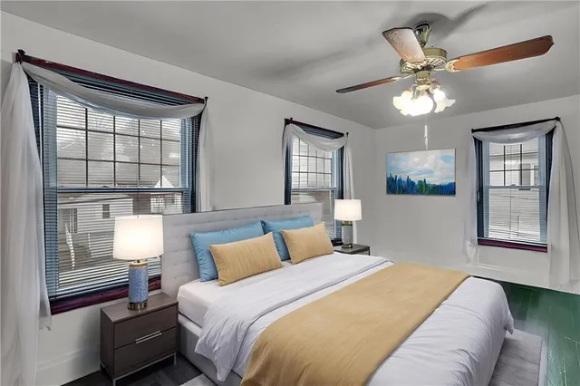 a bedroom with a bed and window