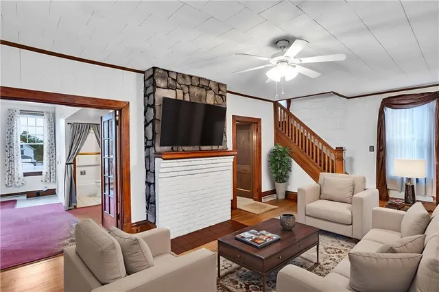 a living room with furniture and a flat screen tv