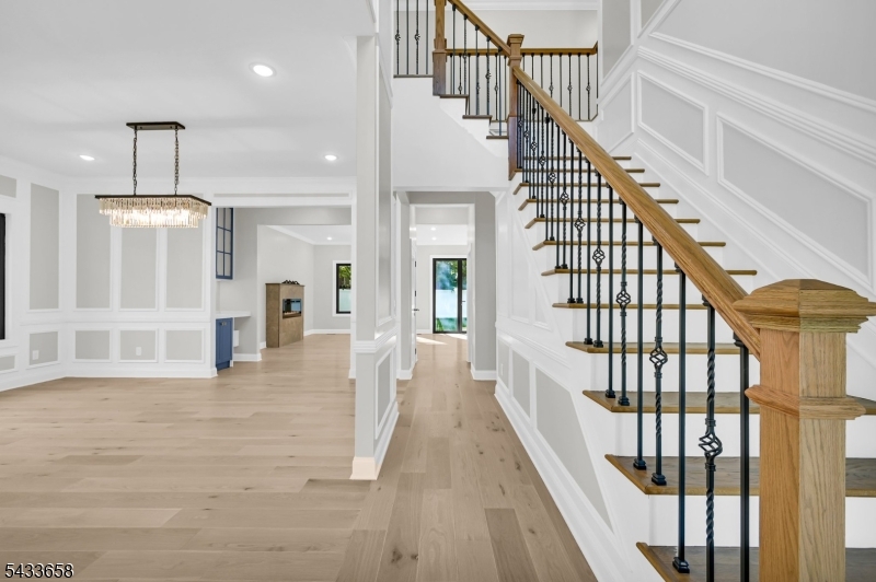 2 Orchard Road Florham Park, NJ 07932 - Photo 6 of 23 a view of staircase with white walls and chandelier