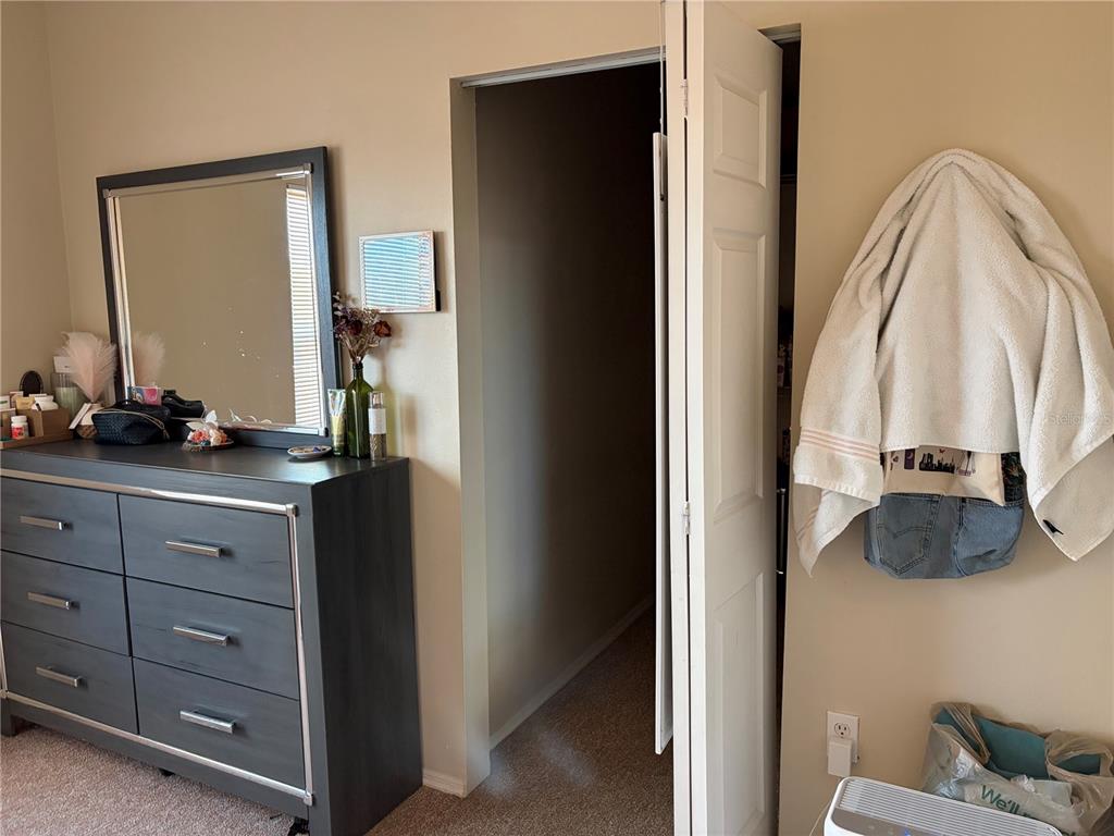 10764 70th Avenue, Unit 2301 Seminole, FL 33772 - Photo 13 of 19 a view of bathroom with mirror and window