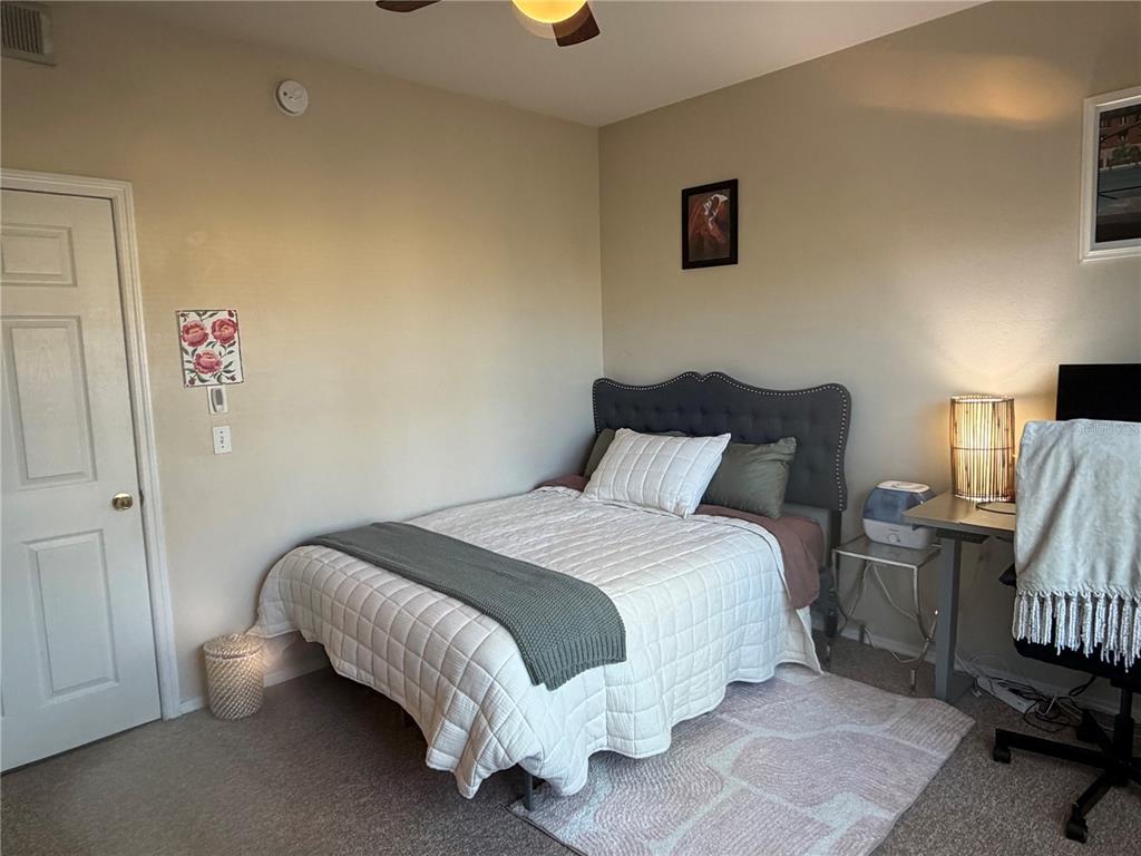 10764 70th Avenue, Unit 2301 Seminole, FL 33772 - Photo 15 of 19 a bedroom with a bed and a window