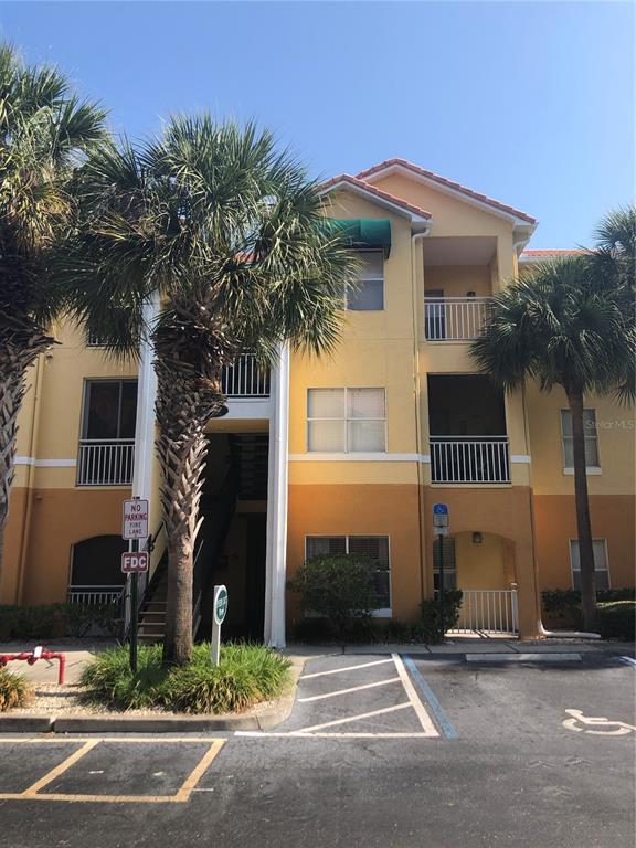 10764 70th Avenue, Unit 2301 Seminole, FL 33772 - Photo 2 of 19 a front view of a house with a yard and garage