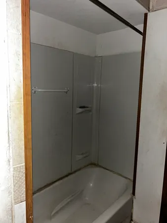 a bathroom with a glass shower door