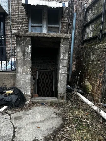 a front view of a house with parking space