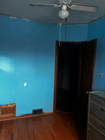 a view of room with window and hardwood