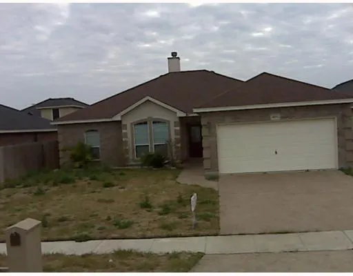 a view of a yard in front of a house