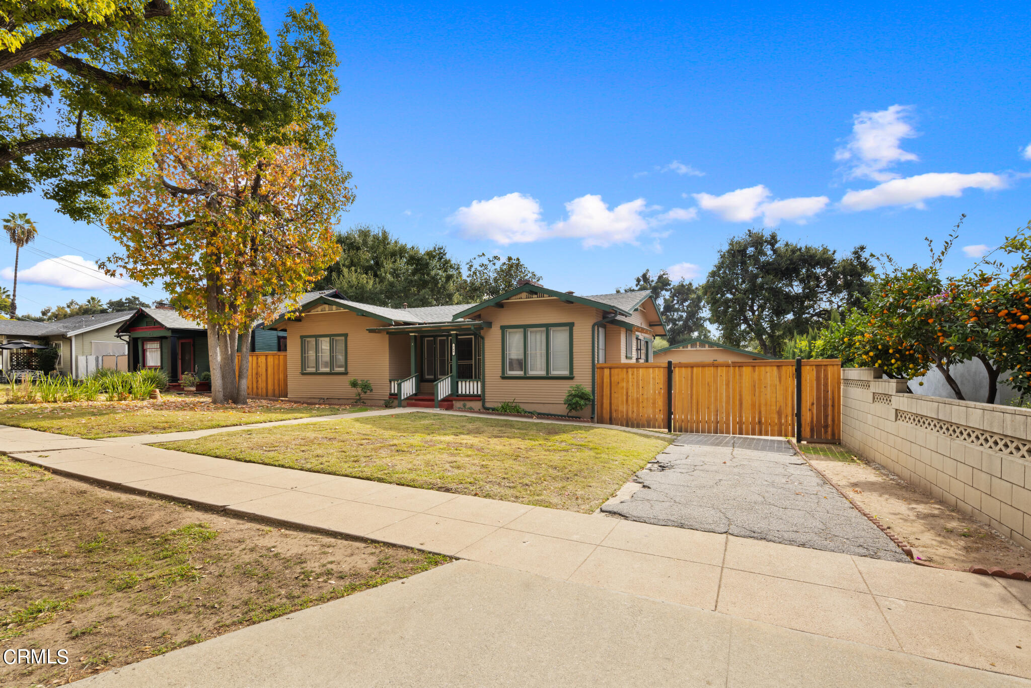 768 Atchison Street Pasadena, CA 91104 - Photo 2 of 23 a front view of a house with a yard and trees