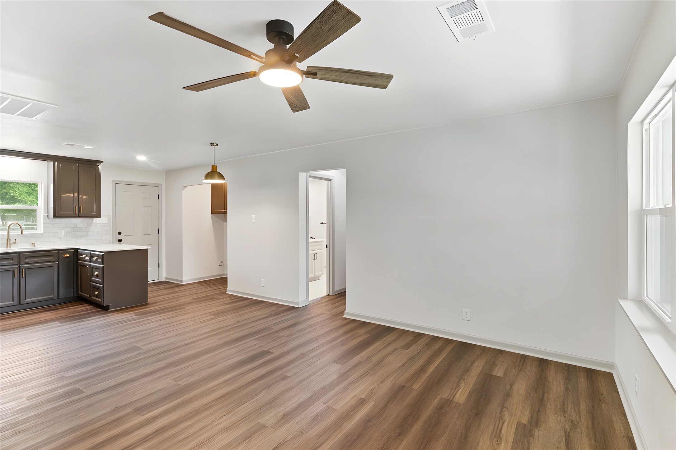 1108 Nottingham Drive Angleton, TX 77515 - Photo 20 of 23 wooden floor in an empty room with a window
