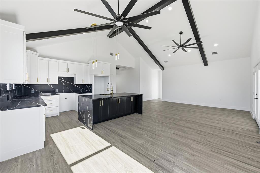 2618 Gooch Street Dallas, TX 75241 - Photo 10 of 28 a large kitchen with stainless steel appliances kitchen island a stove a refrigerator a sink and dishwasher