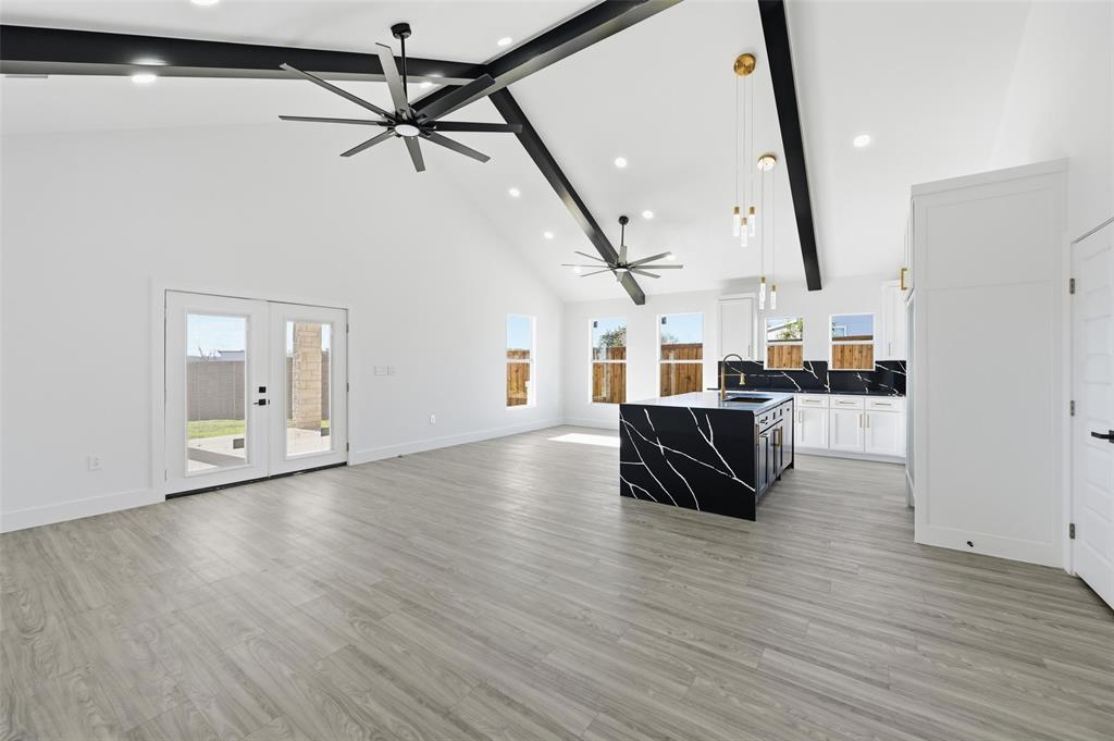2618 Gooch Street Dallas, TX 75241 - Photo 6 of 28 a view of kitchen and hall with wooden floor